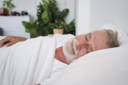Senior man sleeping after taking at-home sleep apnea test in Vero Beach