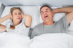 Snoring man in bed with wife, may have sleep apnea in Vero Beach