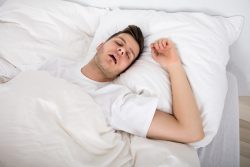 Snoring man, may need sleep testing in Melbourne