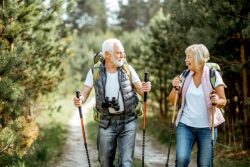 Healthy senior couple hiking outside