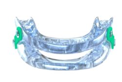 Oral appliance for sleep apnea featured against white background