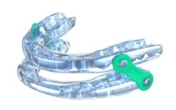 Oral appliance for sleep apnea pictured against white background